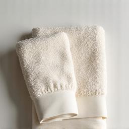 Luxurious organic cotton hand towel in a natural, undyed hue.